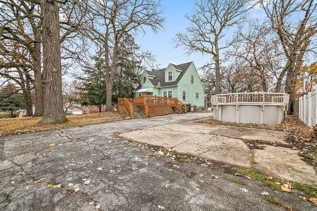 a view of a house with snow on the road