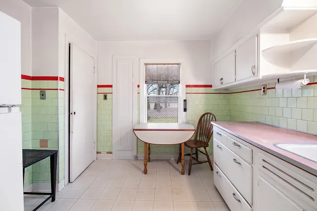 a room with a sink and a mirror