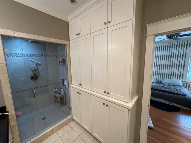 a bathroom with a shower and a sink
