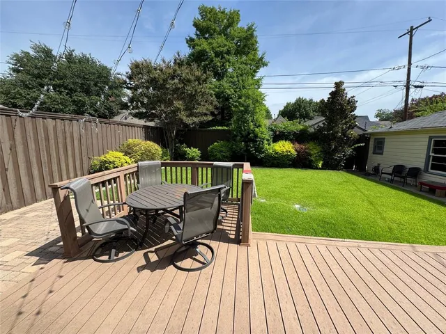 a view of a wooden deck with a bench
