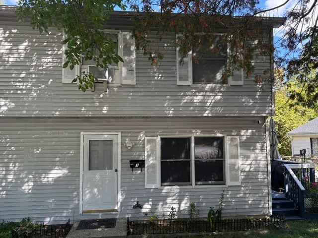 a front view of a house with glass windows