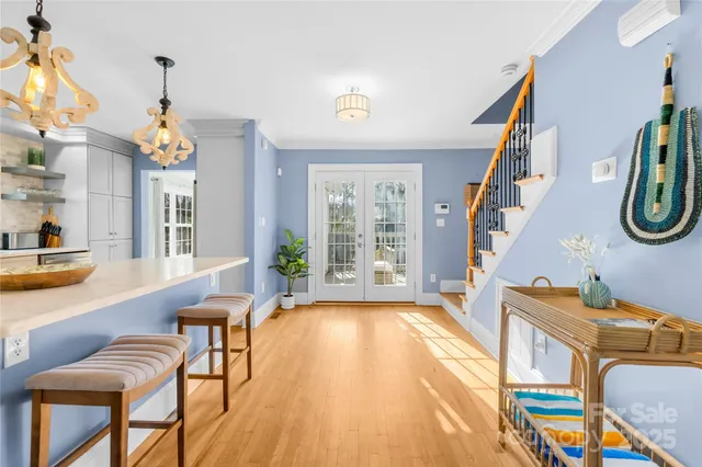 a very nice looking room with many windows and furniture