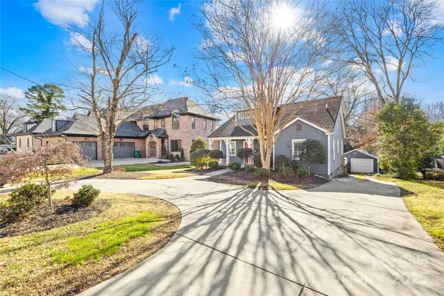 a view of a house with a yard covered with snow