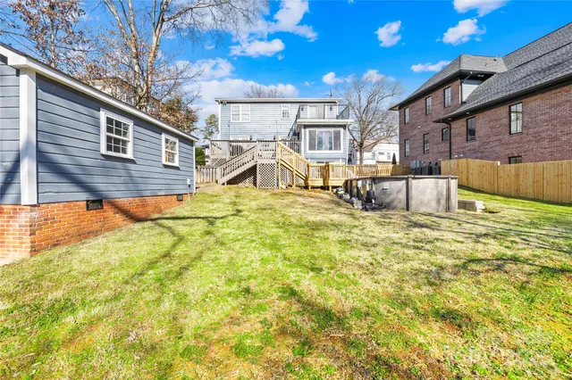 a view of a backyard with table and chairs