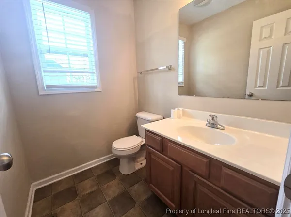 a balcony with wooden floor and outdoor space