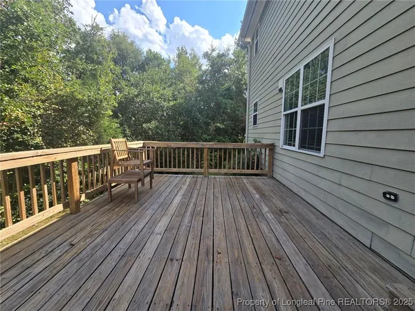 a view of balcony with furniture