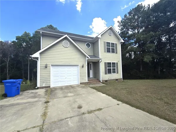 a front view of a house with a garage