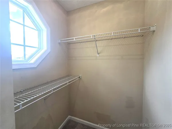 a spacious bathroom with a double vanity sink mirror and double