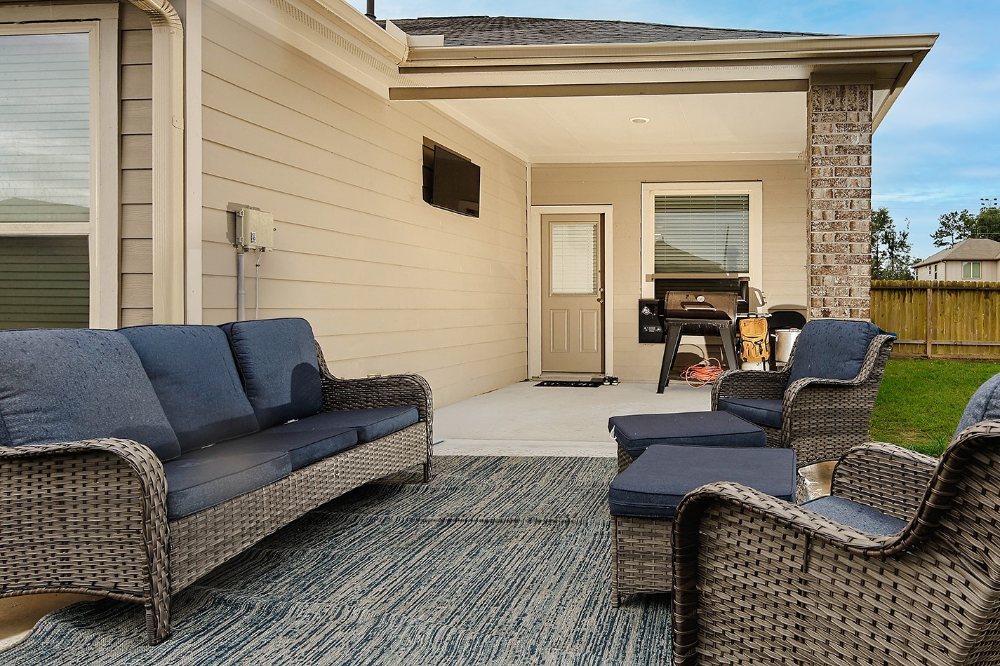 26324 Cooperstown Way Splendora, TX 77372 - Photo 20 of 23 a outdoor living space with furniture and a potted plant