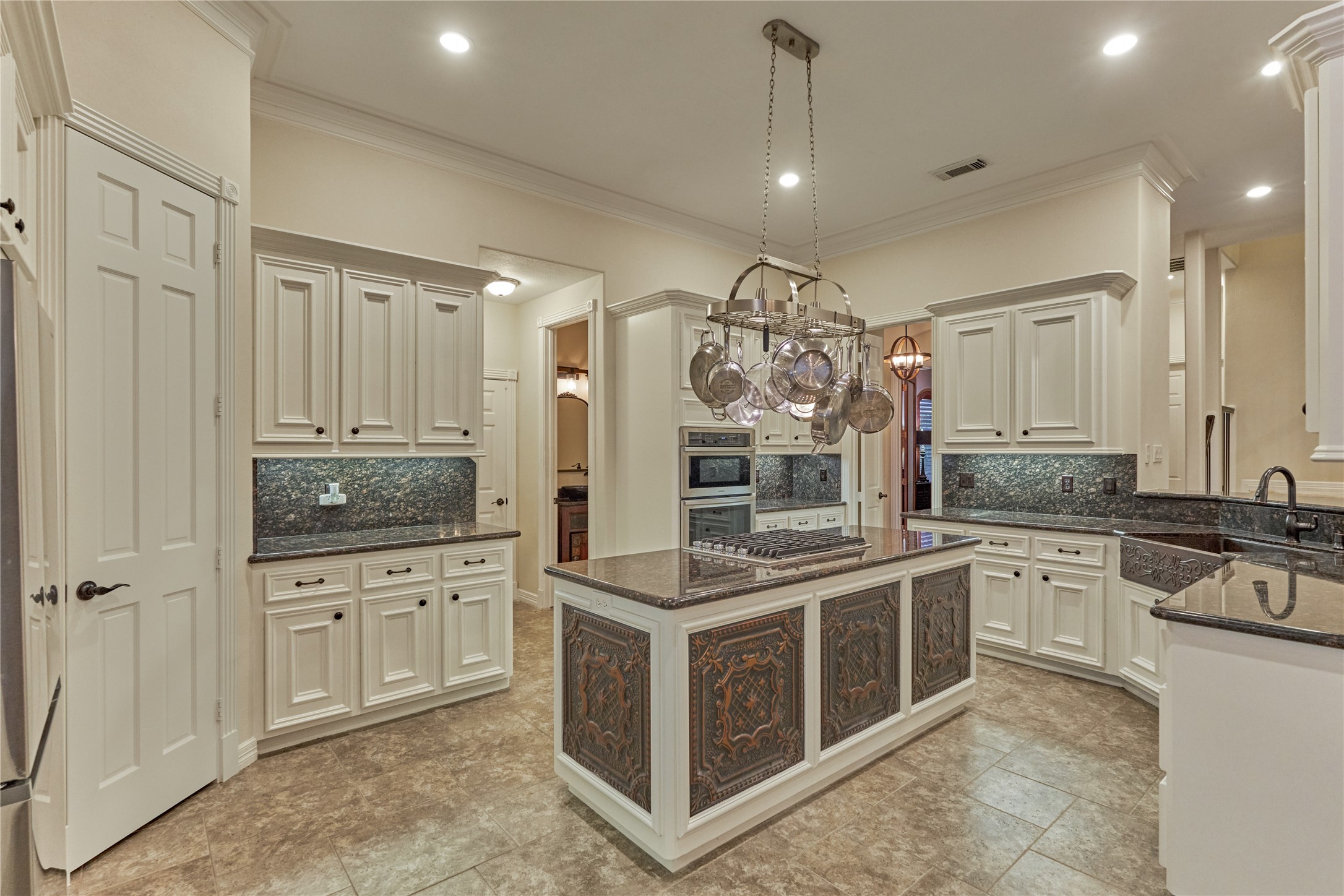 203 Monterrey Road East Montgomery, TX 77356 - Photo 15 of 50 Kitchen updates include repainted cabinets and new hardware. New appliances include the dishwasher, oven, gas stove, and microwave.
