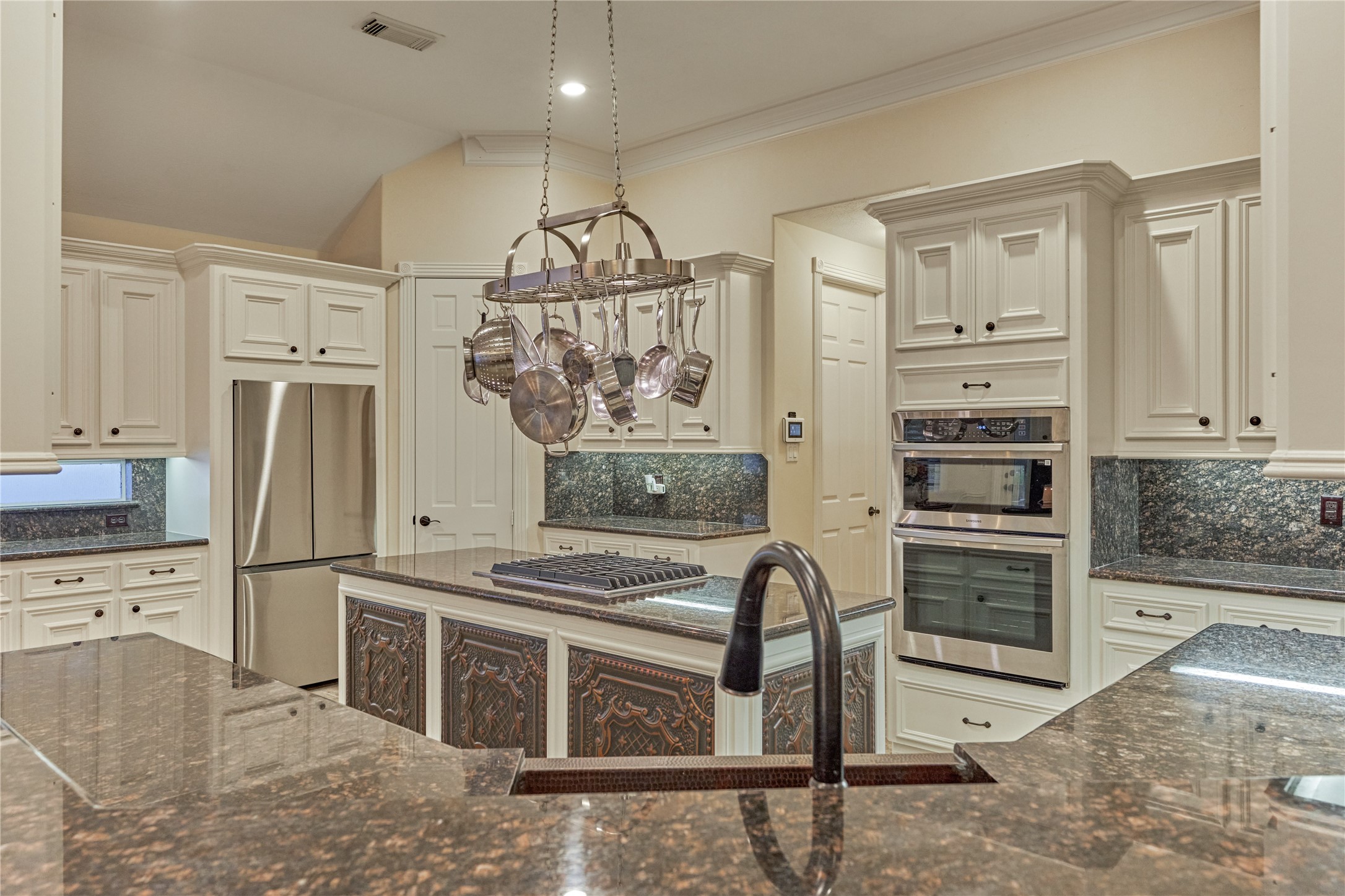 203 Monterrey Road East Montgomery, TX 77356 - Photo 17 of 50 Gorgeous granite countertops compliment the sink and tile inlay, creating a flawless and cohesive design.