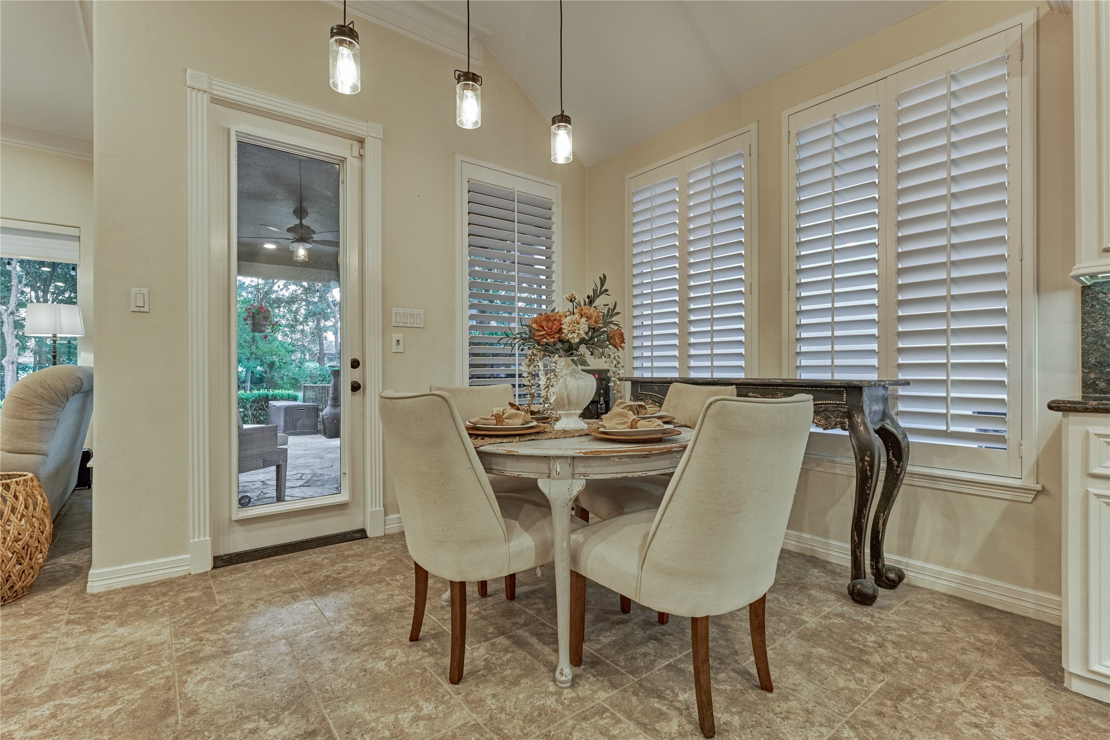 203 Monterrey Road East Montgomery, TX 77356 - Photo 19 of 50 The breakfast area/dining room is showcased by the new plantation shutters along the wall of windows.