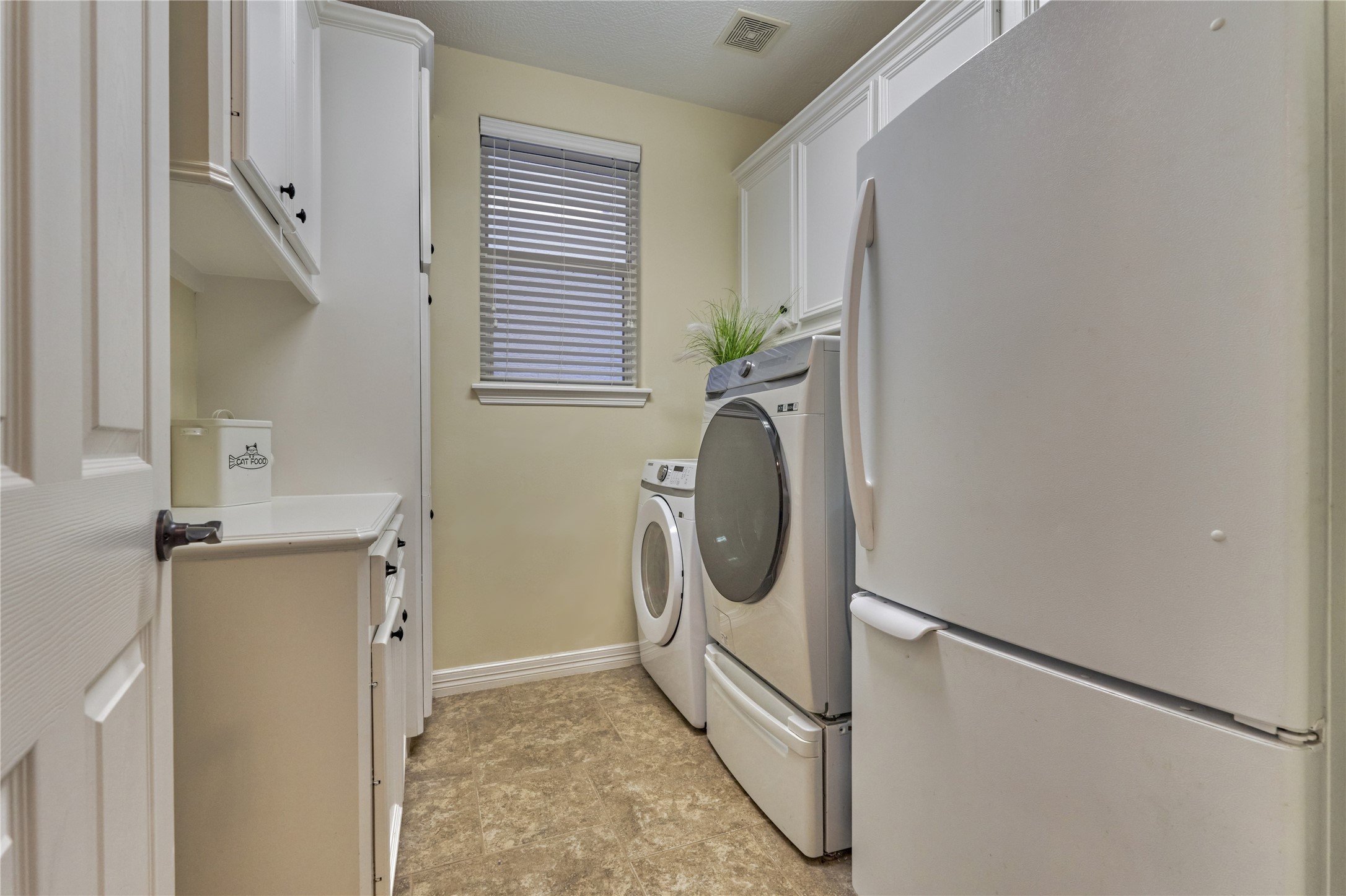 203 Monterrey Road East Montgomery, TX 77356 - Photo 22 of 50 Laundry room with ample storage and room for a refrigerator.