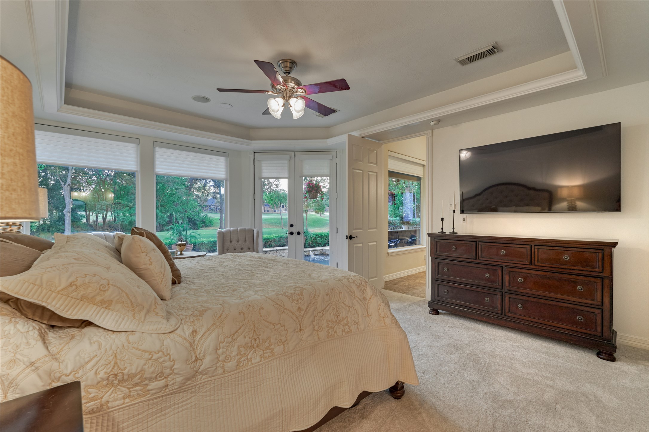 203 Monterrey Road East Montgomery, TX 77356 - Photo 24 of 50 The owner's retreat features new carpeting, a recessed ceiling and large picture windows adorned with new window coverings.