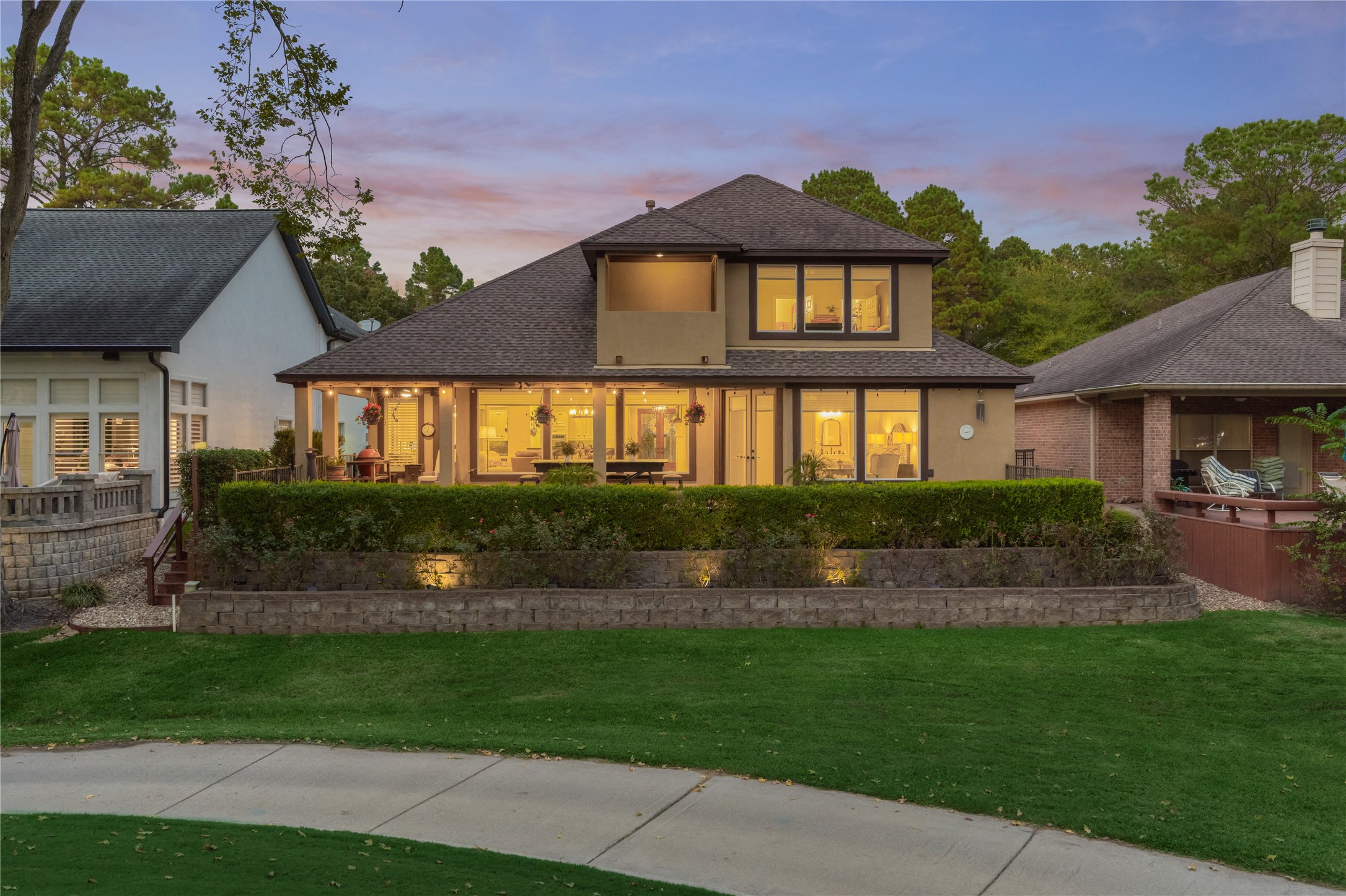 203 Monterrey Road East Montgomery, TX 77356 - Photo 4 of 50 The lush foliage gives privacy, as shown in this photo of the back elevation.