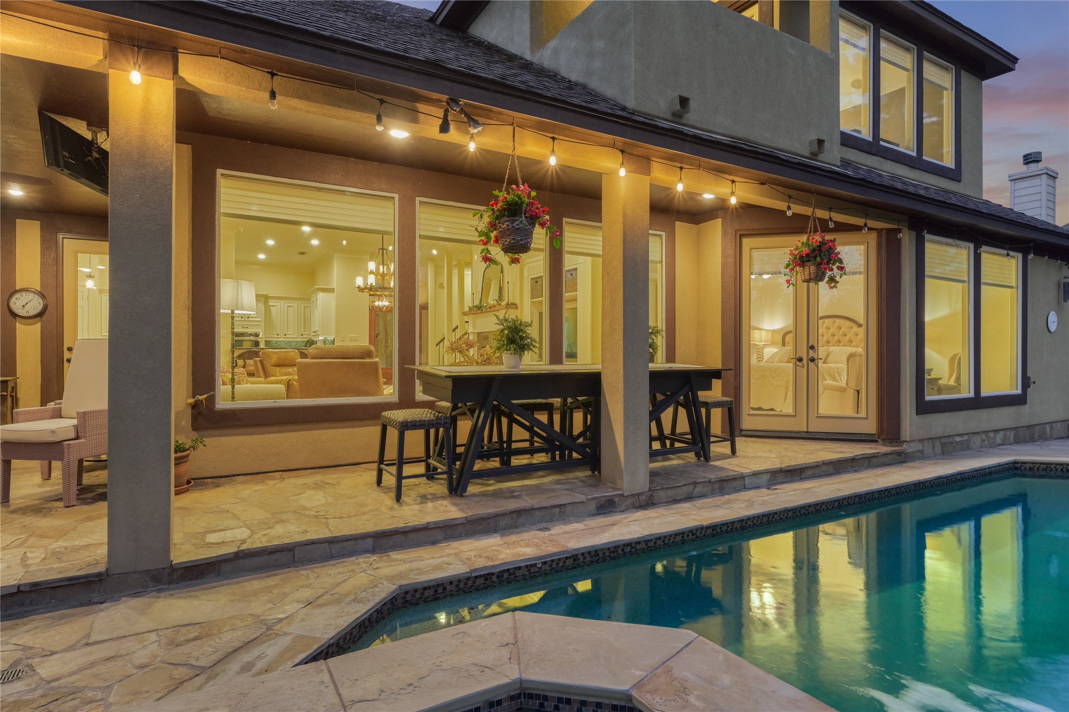 203 Monterrey Road East Montgomery, TX 77356 - Photo 41 of 50 This home is perfect for seamless indoor-outdoor living and extended entertaining, with a beautiful covered patio flowing effortlessly into the sparkling poolside oasis.