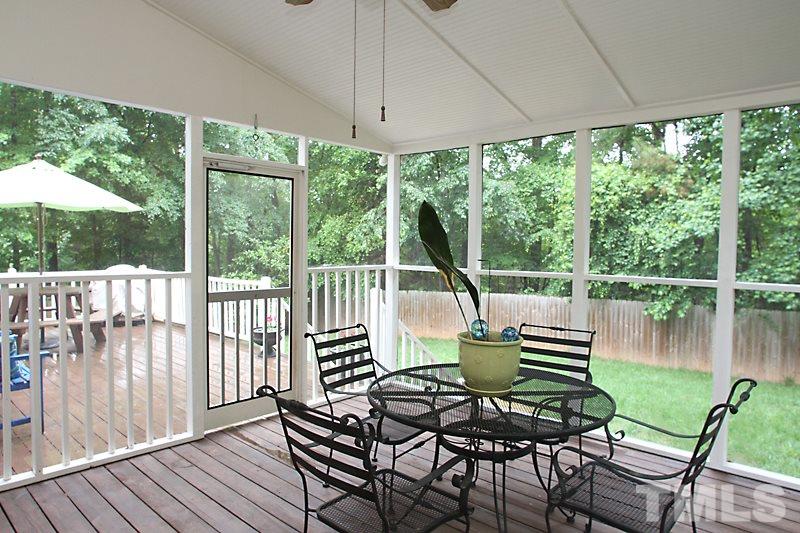 5116 Celbridge Place Raleigh, NC 27613 - Photo 13 of 15 a view of balcony with chairs and wooden floor