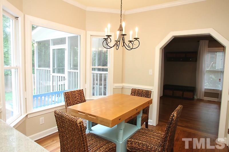 5116 Celbridge Place Raleigh, NC 27613 - Photo 4 of 15 a view of a dining room with furniture window and wooden floor