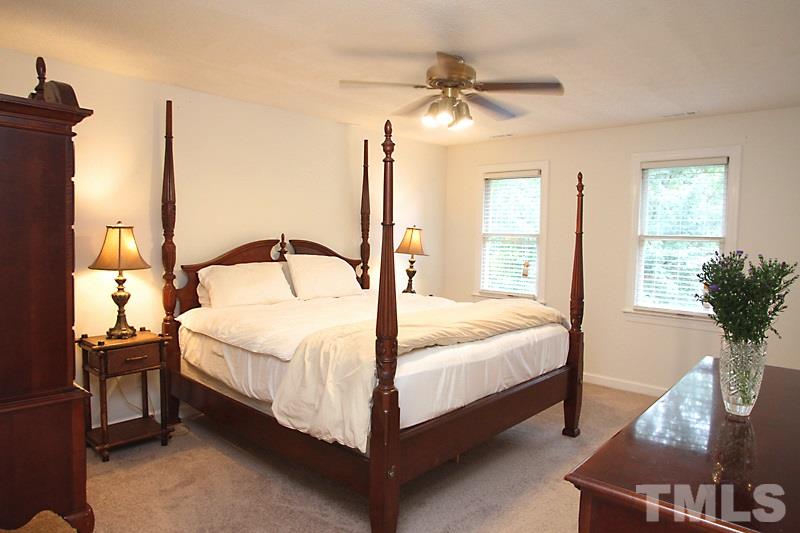 5116 Celbridge Place Raleigh, NC 27613 - Photo 6 of 15 a bedroom with a bed and window