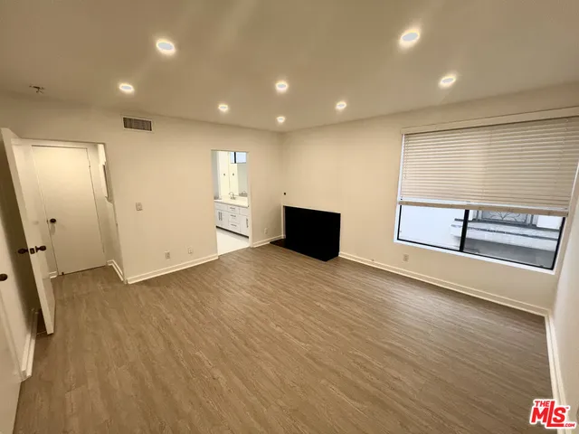 a view of workspace with wooden floor