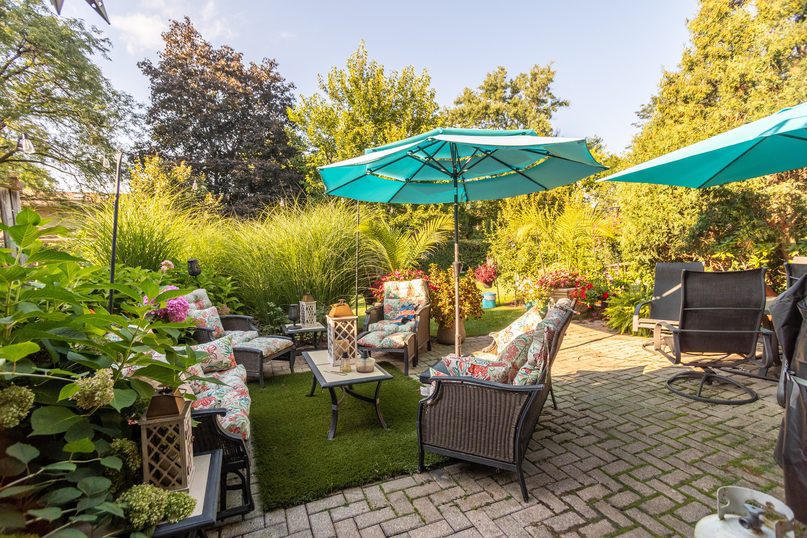 19-w078 Ave Normandy North Oak Brook, IL 60523 - Photo 2 of 15 an outdoor space with furniture and umbrella