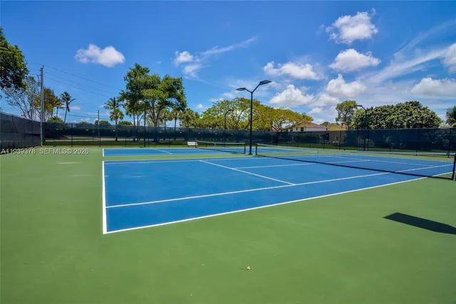 a view of an outdoor space and tennis court