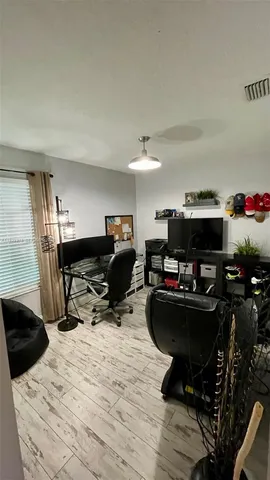 a room with furniture and a wooden floor