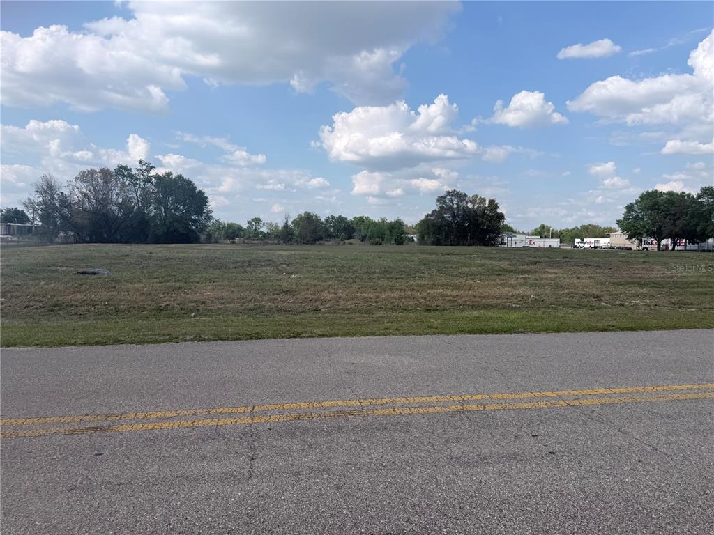 5881 Southwest 25th Street Ocala, FL 34474 - Photo 10 of 11 a view of a lake and a big yard