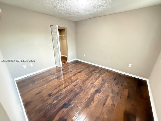 4167 Haverhill Road, Unit 1113 West Palm Beach, FL 33417 - Photo 9 of 19 an empty room with wooden floor