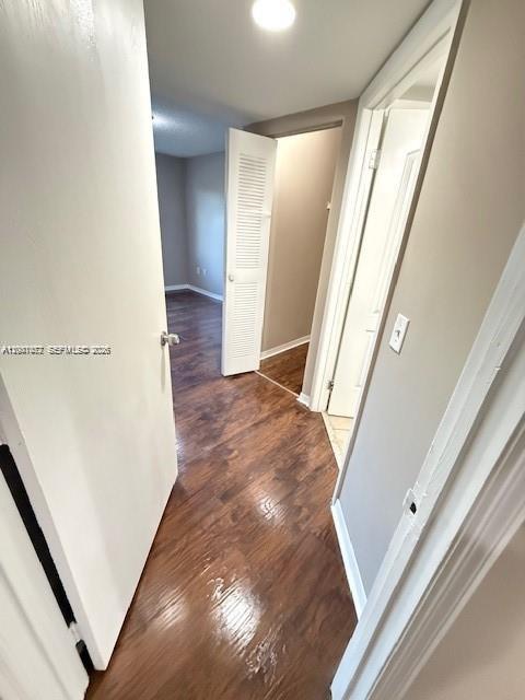 4167 Haverhill Road, Unit 1113 West Palm Beach, FL 33417 - Photo 10 of 19 a view of a hallway with wooden floor and stairs