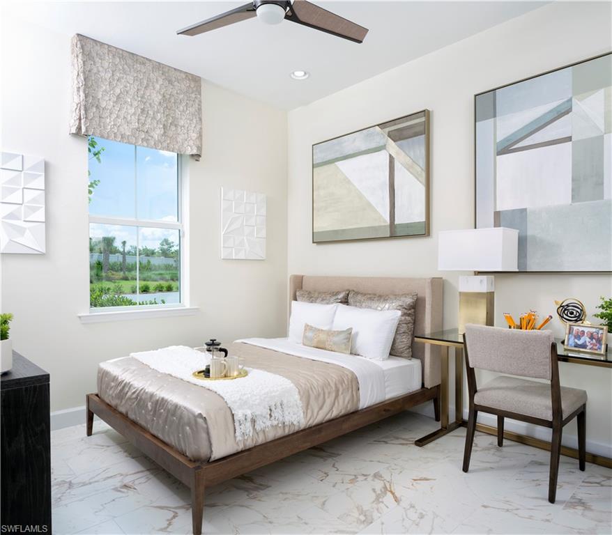 7164 Cayo Coco Lane Naples, FL 34113 - Photo 5 of 19 a bedroom with a bed and a table