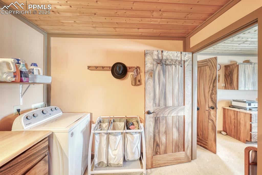 565 Pass Peak Road Westcliffe, CO 81252 - Photo 18 of 50 a utility room with dryer and washer