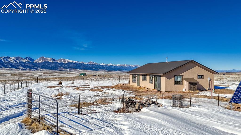 565 Pass Peak Road Westcliffe, CO 81252 - Photo 20 of 50 a view of a house with a ocean view