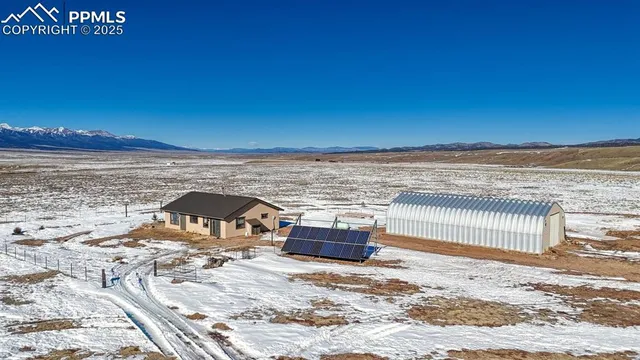 a view of a terrace with wooden floor and a city view