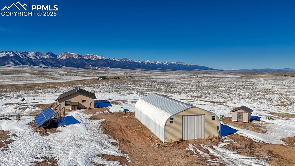 565 Pass Peak Road Westcliffe, CO 81252 - Photo 24 of 50 a view of a terrace with wooden floor and a city view