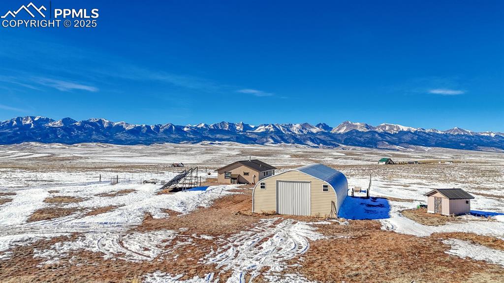 565 Pass Peak Road Westcliffe, CO 81252 - Photo 29 of 50 a view of a ocean with a building in the background