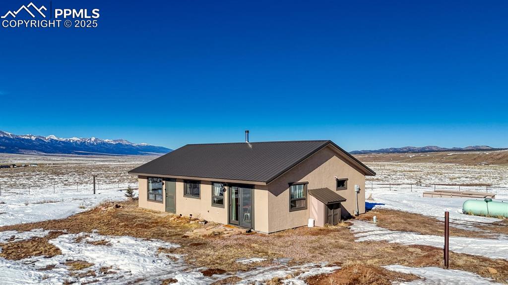 565 Pass Peak Road Westcliffe, CO 81252 - Photo 33 of 50 a front view of a house with a yard