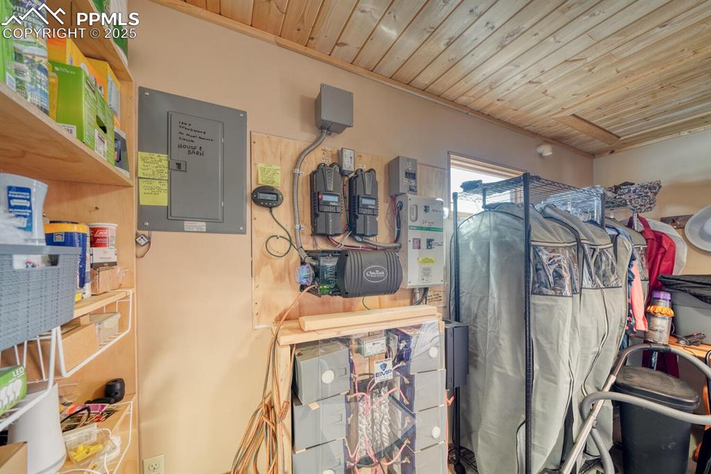 565 Pass Peak Road Westcliffe, CO 81252 - Photo 37 of 50 a view of walk in closet with clothes and shoes