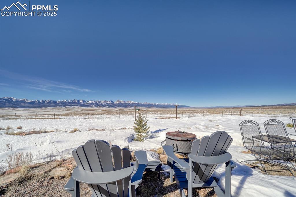 565 Pass Peak Road Westcliffe, CO 81252 - Photo 40 of 50 a view of a chairs and table on the terrace