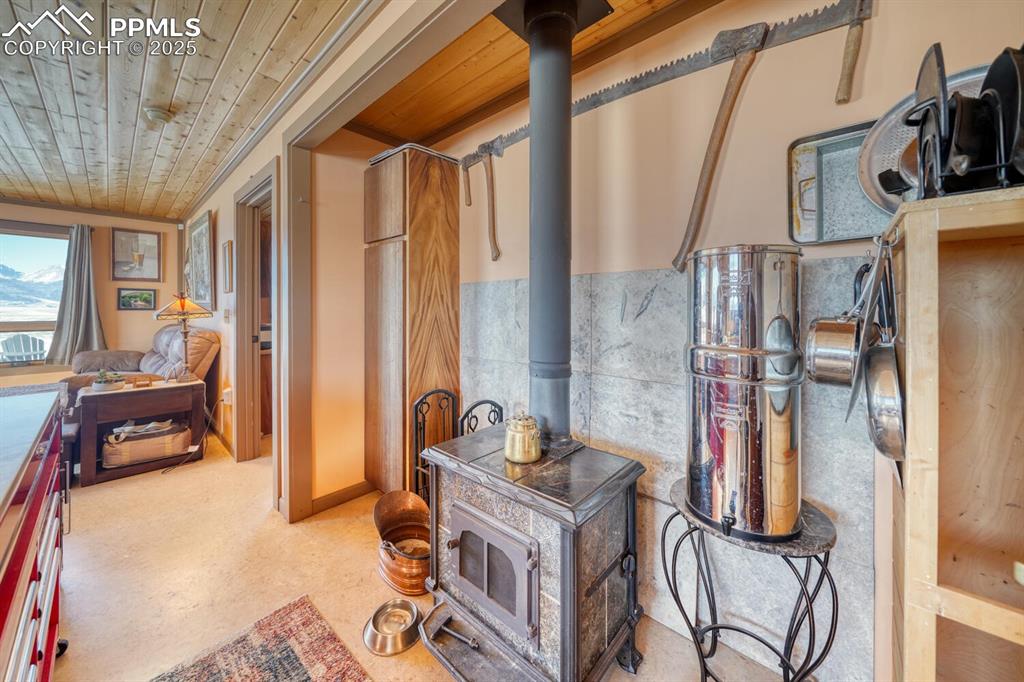 565 Pass Peak Road Westcliffe, CO 81252 - Photo 6 of 50 a bedroom with furniture and a window