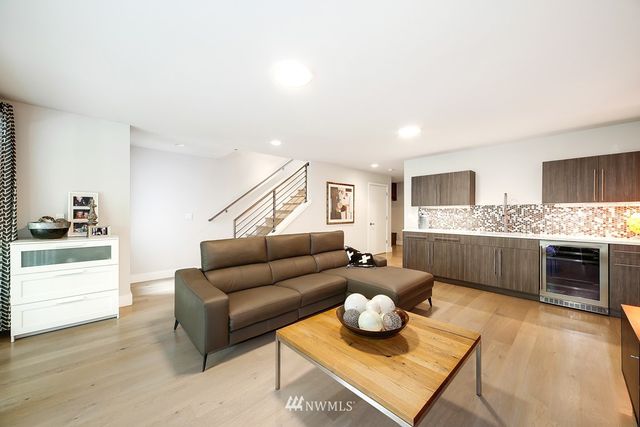 a bathroom with a double vanity sink a mirror and a shower