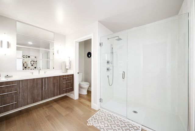 a backyard of a house with barbeque oven table and chairs