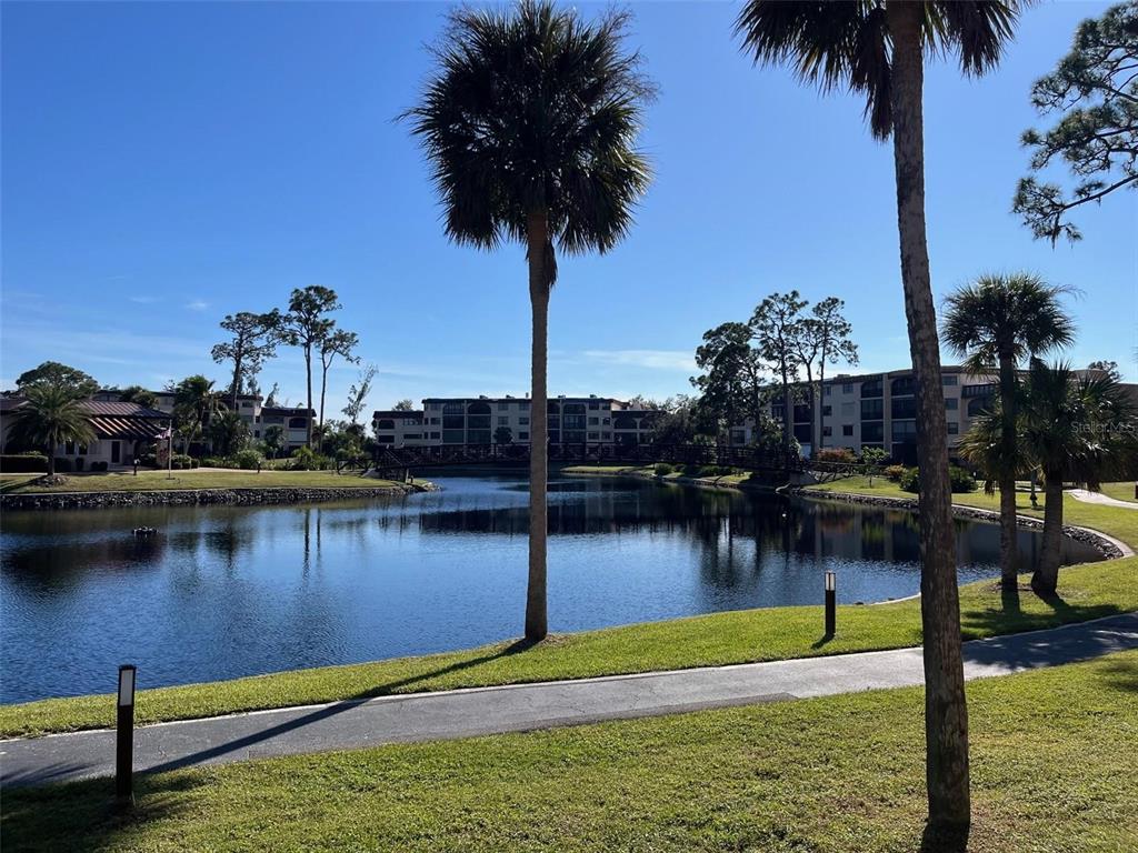 23465 Harbor View Road, Unit 1006 Punta Gorda, FL 33980 - Photo 28 of 41 a view of a lake with boats and palm trees