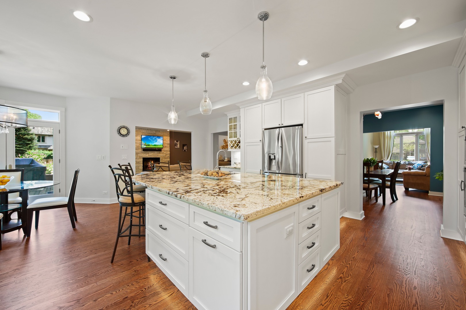 3140 Keystone Road Northbrook, IL 60062 - Photo 7 of 21 a large kitchen with kitchen island a table and chairs in it