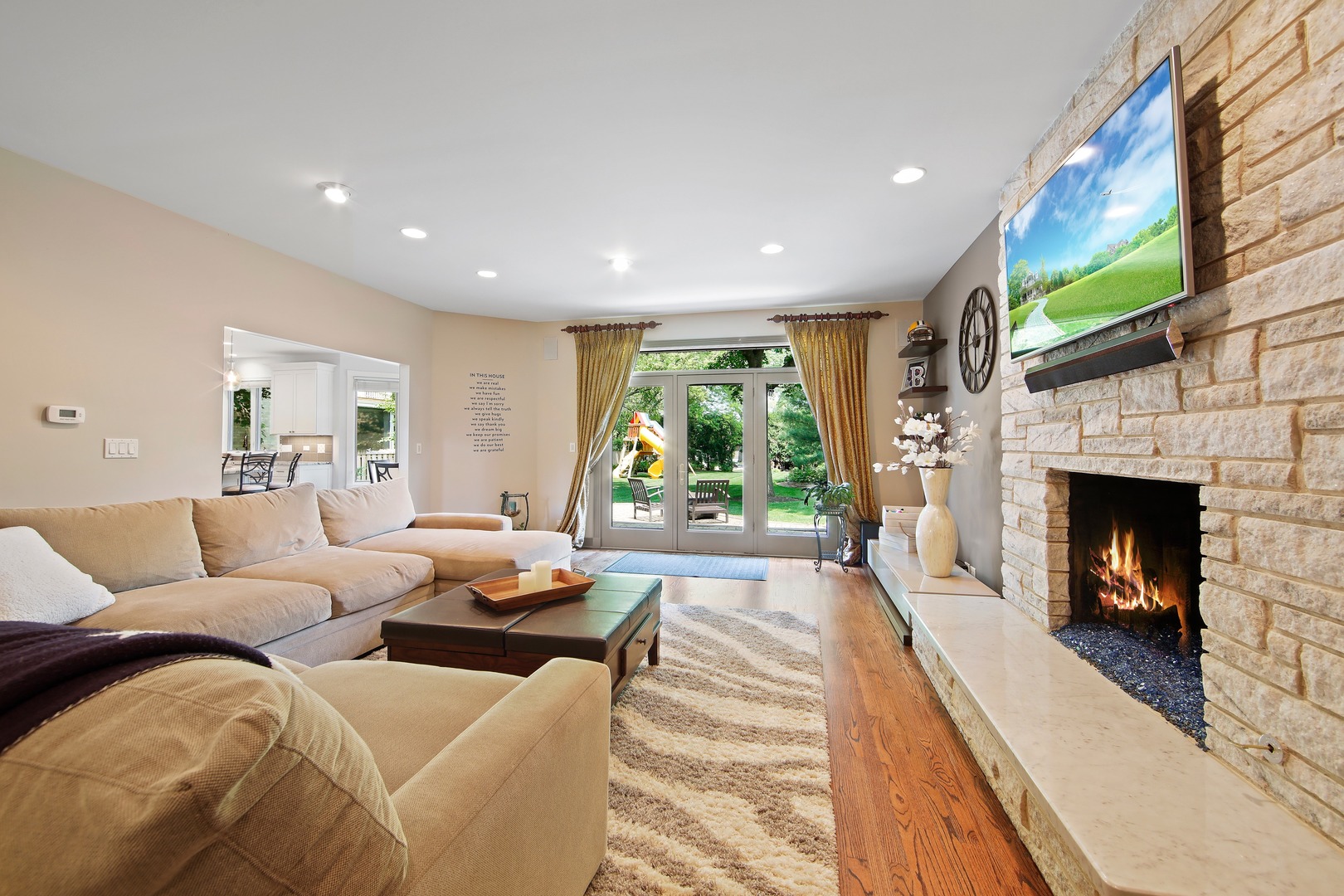 3140 Keystone Road Northbrook, IL 60062 - Photo 8 of 21 a living room with furniture large window and a fireplace