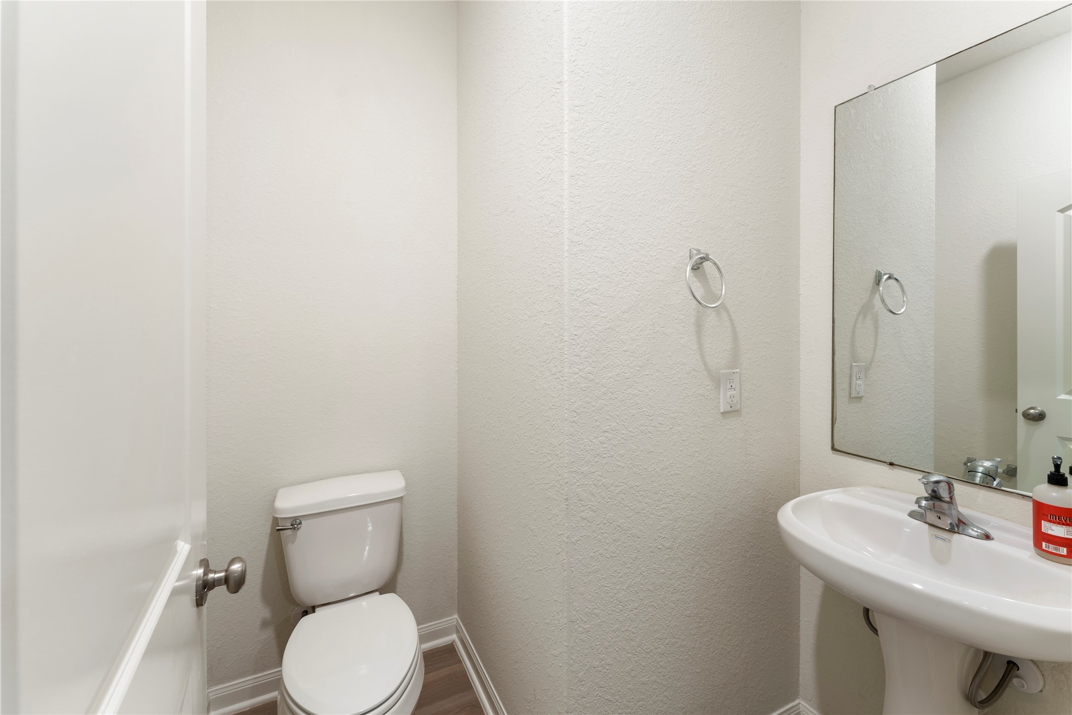 9702 Opal Gates Drive Rosharon, TX 77583 - Photo 8 of 43 a bathroom with a sink a toilet and a mirror