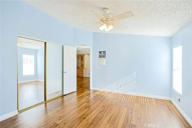 a spacious bathroom with a tub sink and mirror