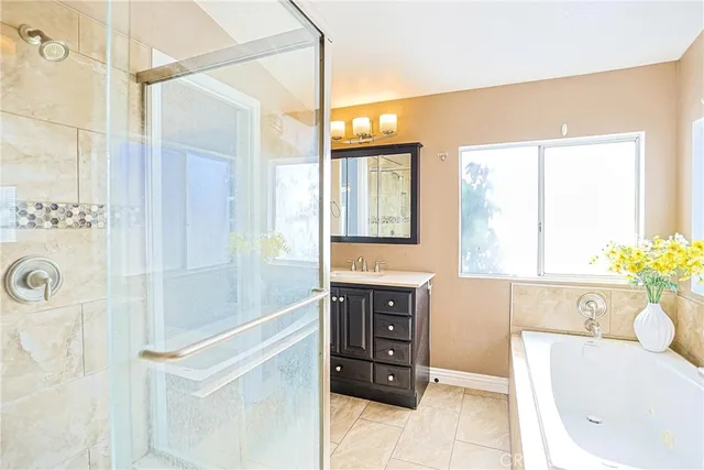 a bathroom with a sink a mirror and a window