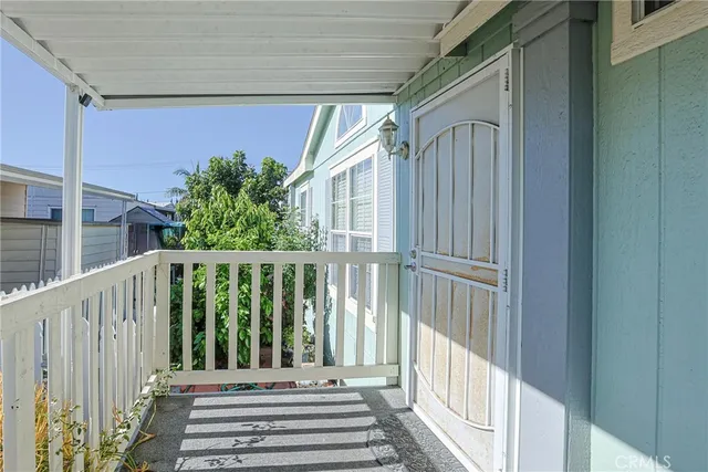 a view of balcony with wooden floor
