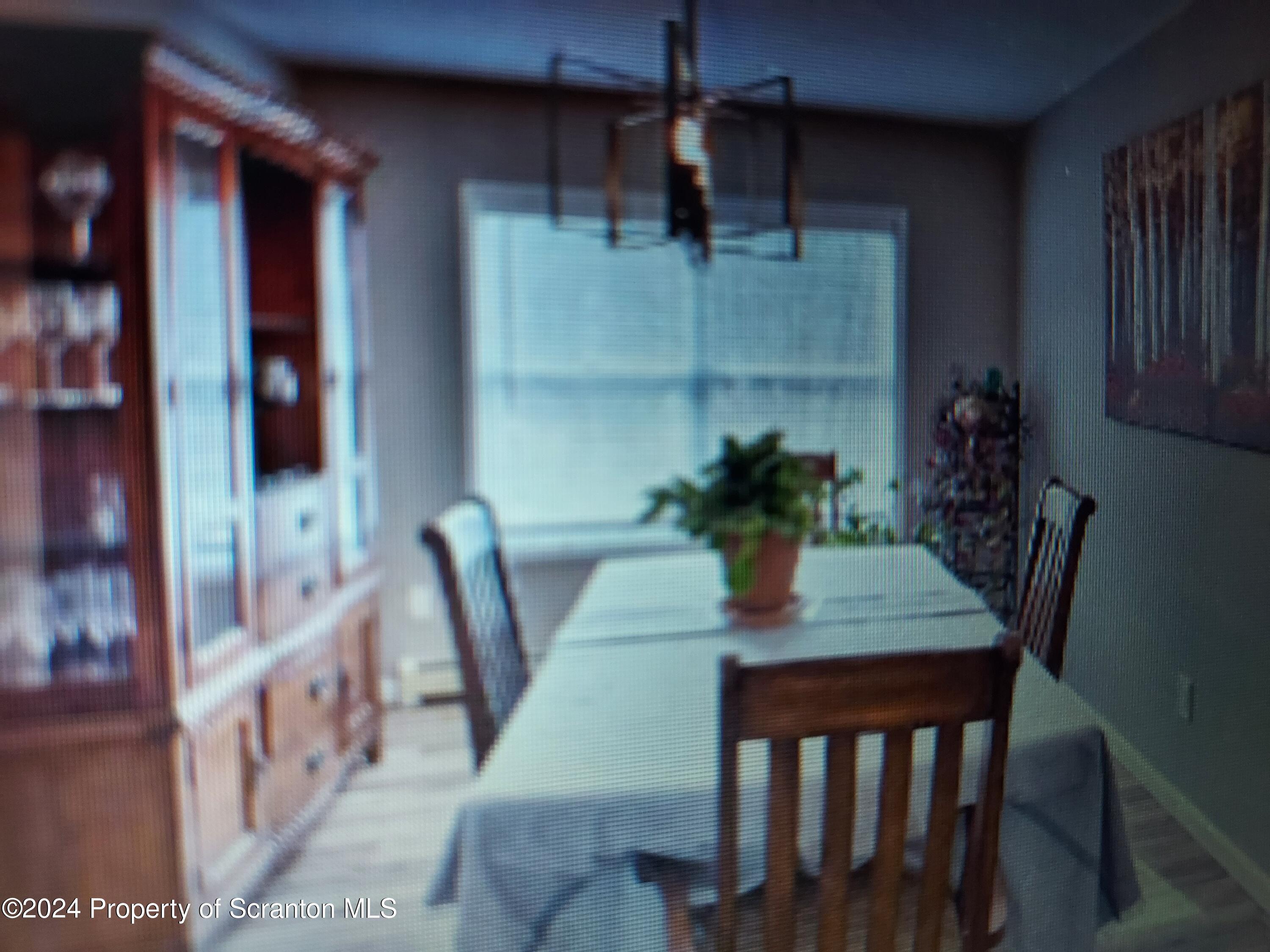 620 Layton Road Clarks Summit, PA 18411 - Photo 2 of 7 a dining room with furniture and wooden floor